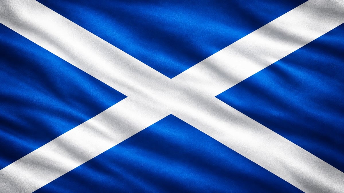 Scottish flag with blue background and white saltire cross, gently waving